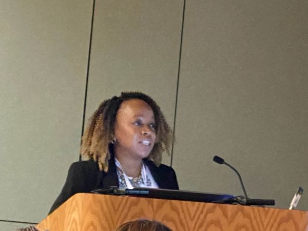 Caroline-Kibakaya-presenting-at-APA-conf.jpg
